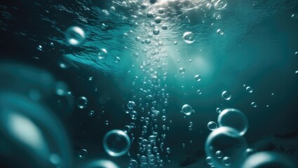 Air bubbles rising underwater in the pure blue sea