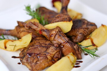 roasted duck leg with mashed potatoes and fresh salad on the plate closeup. horizontal view from abovel 