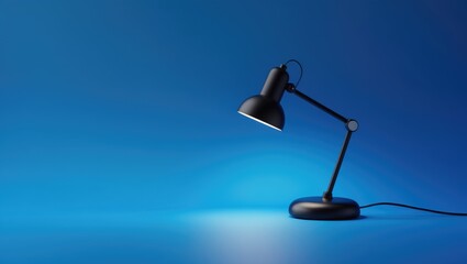 Small dark blue lamp set against bright blue backdrop highlighting study and learning ideas