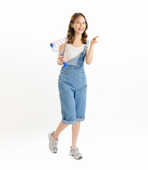 Appealing Asian woman holds paintbrushes on white background.