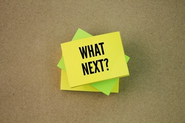Colored paper with the word question What's Next? next step concept