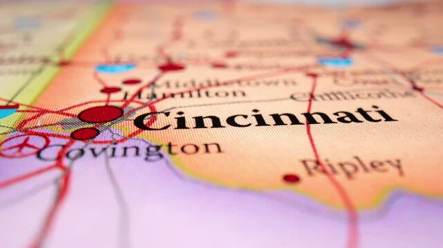 Closeup Of Printed Map Highlighting Cincinnati, Ohio, With Nearby Cities Of Covington And Ripley. dolly-in shot, racking focus