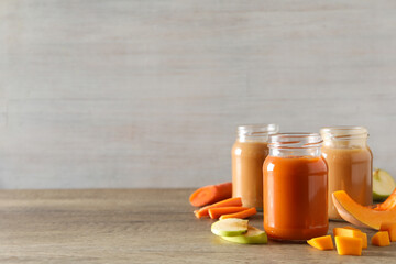 Children's vegetable and fruit puree, on a light background.