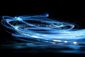 Dynamic swirling blue light trails on black background.