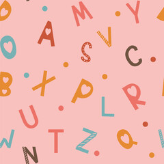 A seamless vector design featuring uppercase letters of the alphabet in playful fonts and colors, decorated with heart motifs, arranged randomly on a light pink background