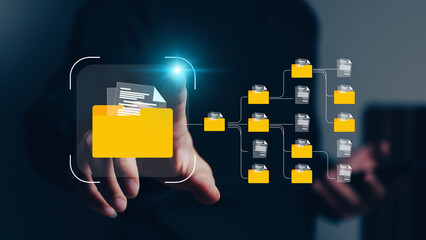 Conceptual image representing a digital data management system, network, or cloud computing service, with holographic documents and a folder displayed above a hand.