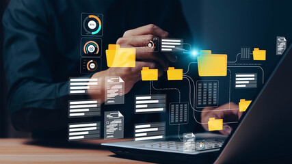 Conceptual image representing a digital data management system, network, or cloud computing service, with holographic documents and a folder displayed above a hand.