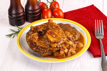 Italian cuisine - ossobuco with sauce