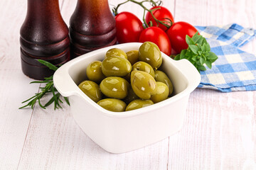 Green marinated olives in the bowl