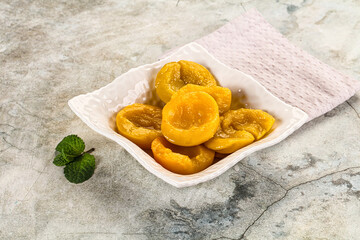 Canned marinated peach in syrop