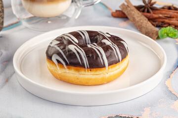 Delicous sweet donut with chocolate glaze