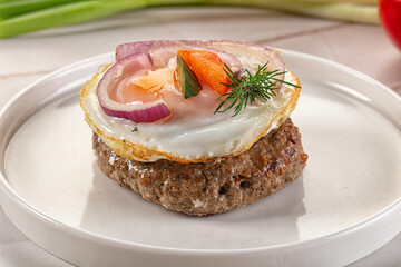 Beefsteak chop with roasted egg