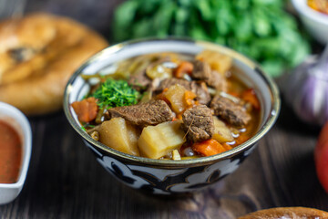 Asian cuisine, lagman soup with meat and vegetables