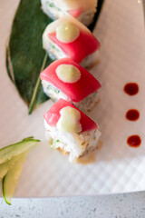 Beautifully plated sushi roll with sauce