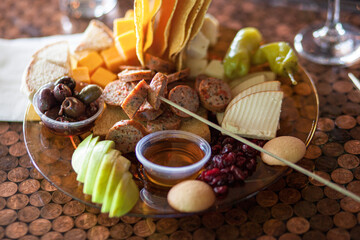 Charcuterie pub board with sausage fruits and cheeses