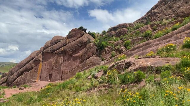 Reddish rock formations in Aramu Muru near Puno in Peru