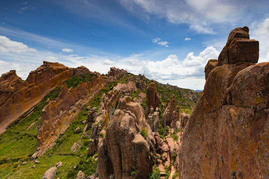 Reddish rock formations in Aramu Muru near Puno in Peru