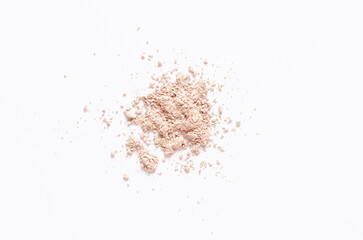 A sample of dry cosmetic clay for a mask or cosmetic powder. White background