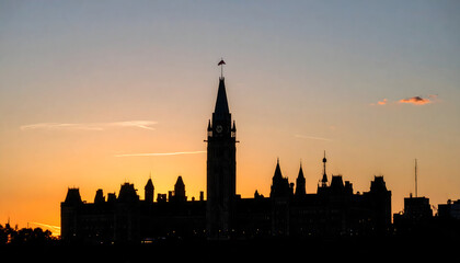 Fototapeta premium Iconic Parliament buildings in shadow at dusk during Canada Day