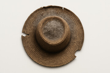 Striking Vintage Straw Hat Showcasing Unique Wear Resembling a Distinct Design Artifact From a Bygone Era