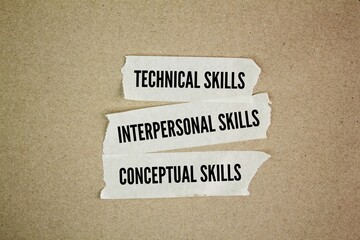 White stickers with the words technical skills, interpersonal (or human) skills, and conceptual skills. three critical skill sets for successful leaders