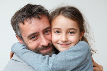 Obraz premium Father and daughter share a warm embrace, showcasing love and connection in a bright, cheerful environment