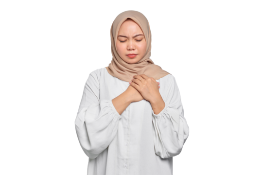 Portrait of Asian Muslim woman has a heart attack and closes eyes isolated on transparent background