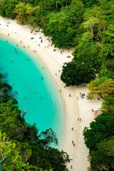 Experience the serene shores of Koh Hong Island in Krabi, Thailand, where soft sands merge with...