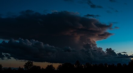 Dramatic Ominous Cumulonimbus Cloudscape against Dark Blue Evening Sky