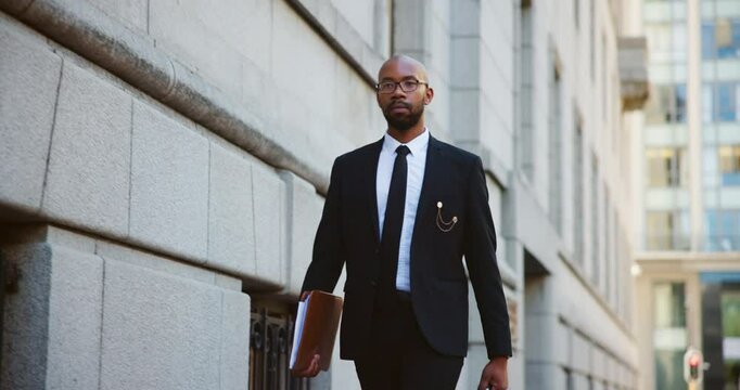 Briefcase, city and walking with black man lawyer outdoor as legal council for court case or trial. Consultant, folder and travel with attorney at law downtown for commute to appointment as advocate