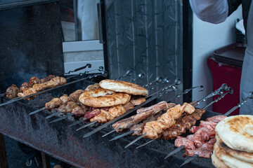 close up of russian street food "shashlik" being grilled on stove