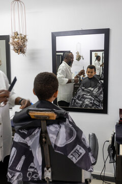 Young boy having his hair cut