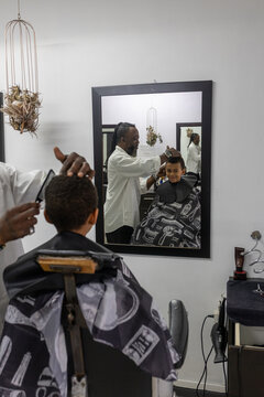 Young mixed race boy at the barber