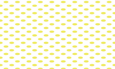 薄っすらとオレンジがかった横長の楕円形の黄色い水玉模様