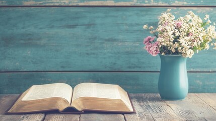 Open Book with Flowers in Vase on Wooden Table