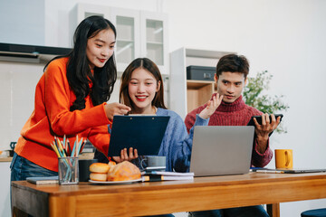 Lifestyle people, businesspeople creative talking discussion ideas sitting in the kitchen.