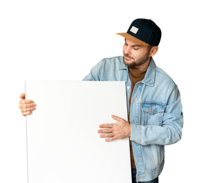 Isolated casual man in snapback interacting with large blank canvas