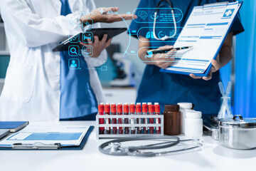 Scientists conducting research in a biotechnology lab, using pipettes and test tubes for medical...