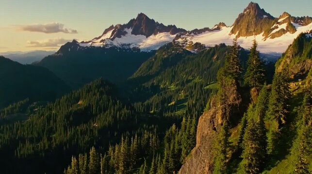 Majestic mountain range at golden hour, snow-capped peaks, lush forests, dramatic valleys - Powered by Adobe