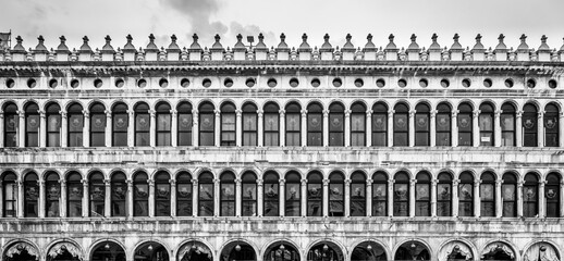 The Old Procuracies at Saint Marc Square showcase intricate architectural details, highlighting...