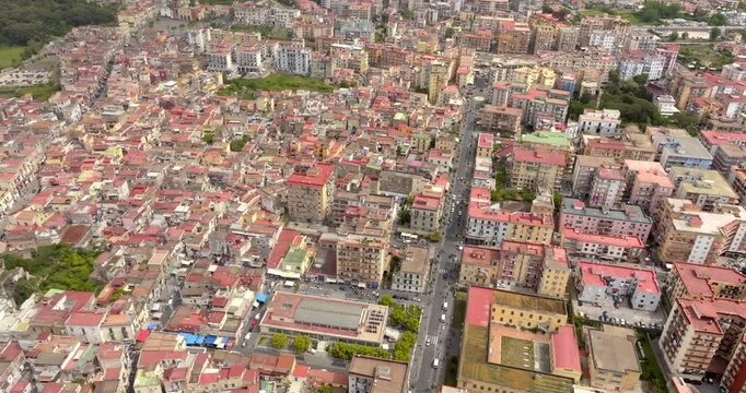 Aerial view of the houses, roofs and buildings of the modern city of Ercolano. It is located in the province of Naples, Campania, Italy.