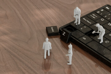 Miniature figures working on a keyboard in a 3D conceptual scene