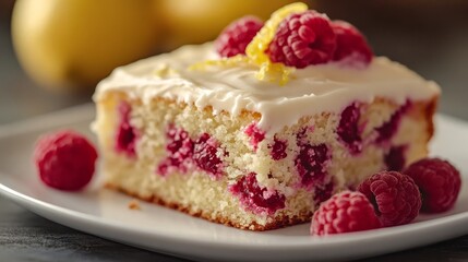 Slice of Raspberry Lemonade Cake with Lemon Zest Icing, Fresh Raspberries, on White Plate, Close Up
