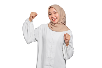 Smiling Asian Muslim woman raises arms and shows muscle isolated on transparent background