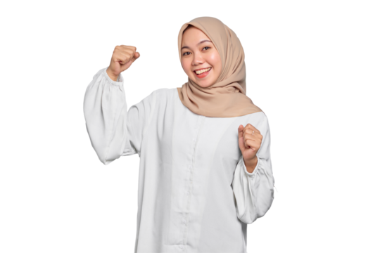 Smiling Asian Muslim woman raises arms and shows muscle isolated on transparent background - Powered by Adobe