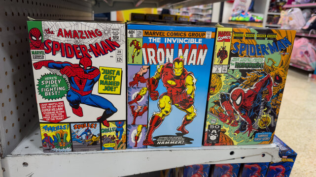 Guayaquil, Ecuador &ndash; May 8, 2025: Vintage editions of Marvel comics like Spider-Man and Iron Man displayed in store, reflecting pop nostalgia and the superhero boom.