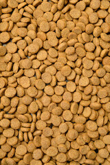 Top view. Pet Food Texture. Lot of Dry Granules of Crunchy Dog or Cat Food. Close up.