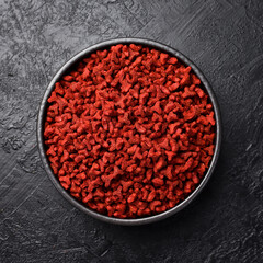 Dry cat food in a bowl. Vitamin food for a complete diet for pets.