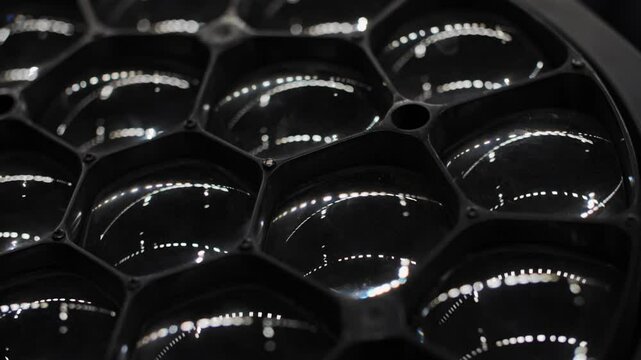 Lens array of a turned-off stage spotlight