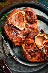 Veal Ossobuco Grilled steak with sea salt, butter and spices. Juicy steak grilled. Top view.
